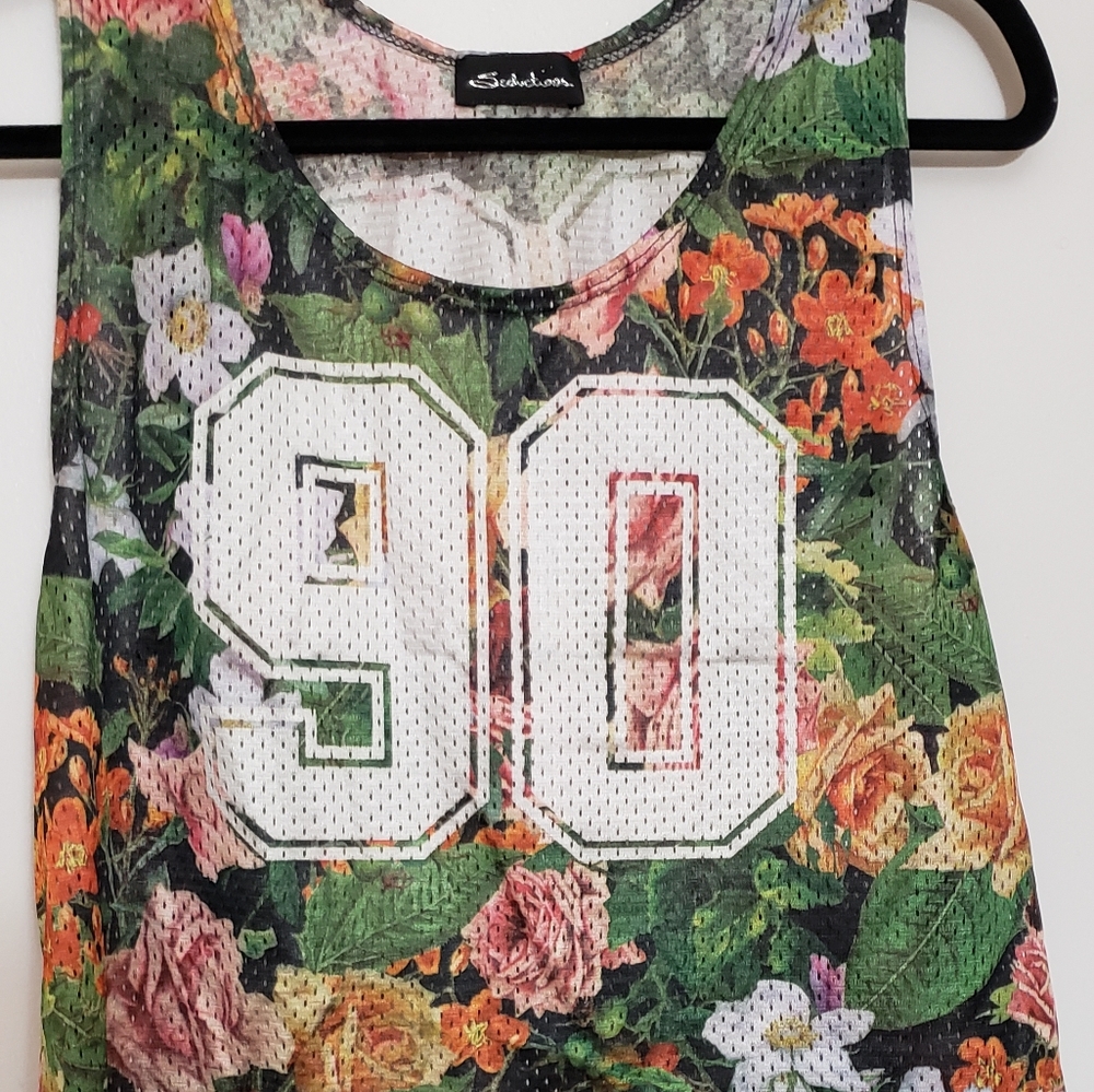 100% polyester. Cropped cute tank jersey